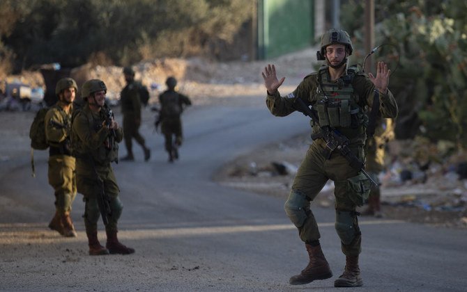 Israeli troops during an army operation following a stone throwing attack on an Israeli driver near the Allon Moreh Israeli settlement, at the West Bank village of Salem near Nablus on Monday, Aug. 23, 2021. (AP)