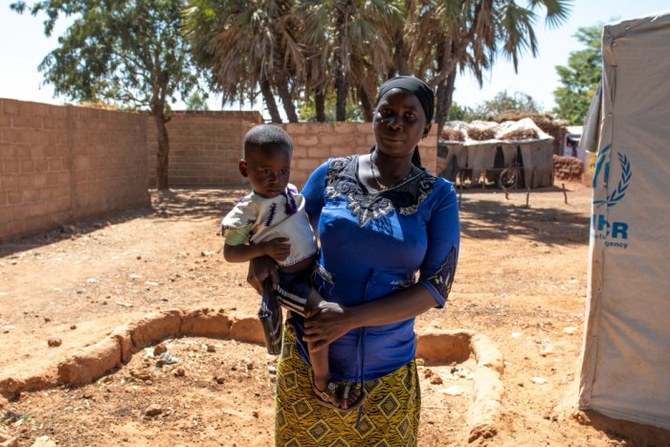 Burkinabe Mamouna Ouedraogo, 37, and family are among some 2.7 million people displaced from their homes in the central Sahel countries of Burkina Faso, Mali and Niger by roving crime gangs. (UNHCR photo/Anne Mimault)