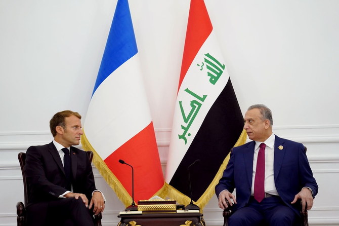 Iraqi Prime Minister Mustafa Al-Kadhimi, right, meets with French President Emmanuel Macron ahead of the Baghdad summit on Aug. 28, 2021. (Reuters)