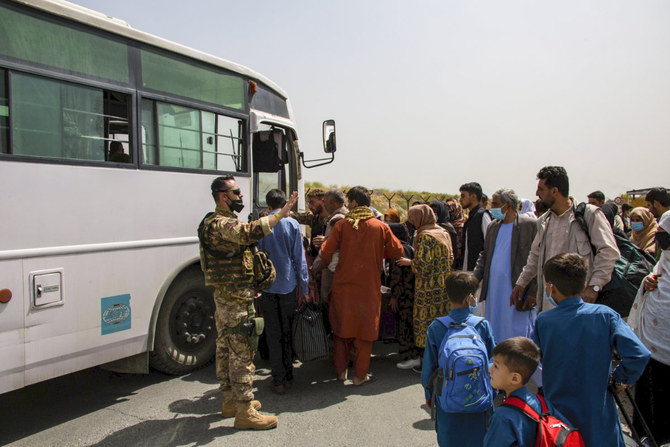 German soldiers process evacuees at Hamid Karzai International Airport in Kabul, Afghanistan, on Aug. 28, 2021. (US Marine Corps photo via AP)