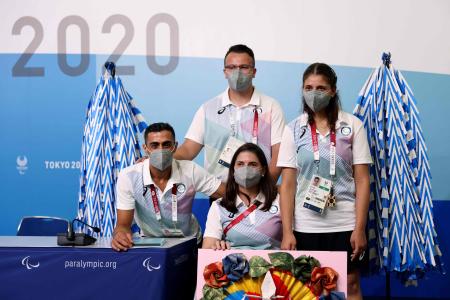 Members of the Paralympic Refugee team, Syrian-born Ibrahim al-Hussain (left), Iranian-born Shahrad Nasajpour (top-C), Syrian-origin Greece-born Alia Issa (right) and the team's chef de Mission Illeana Rodriguez (centre) pose after a press conference in Tokyo on August 23, 2021, on the eve of the Tokyo Paralympic Games. (AFP)