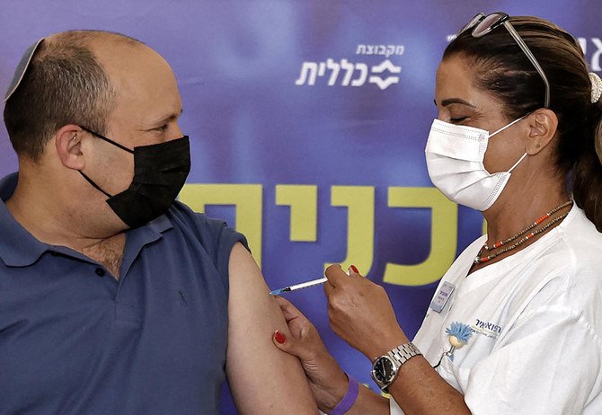 Israeli Prime Minister Naftali Bennett receives a booster shot of vaccine against the coronavirus, at Meir Medical Center in the central Israeli city of Kfar Saba, on August 20, 2021. (File/AFP)