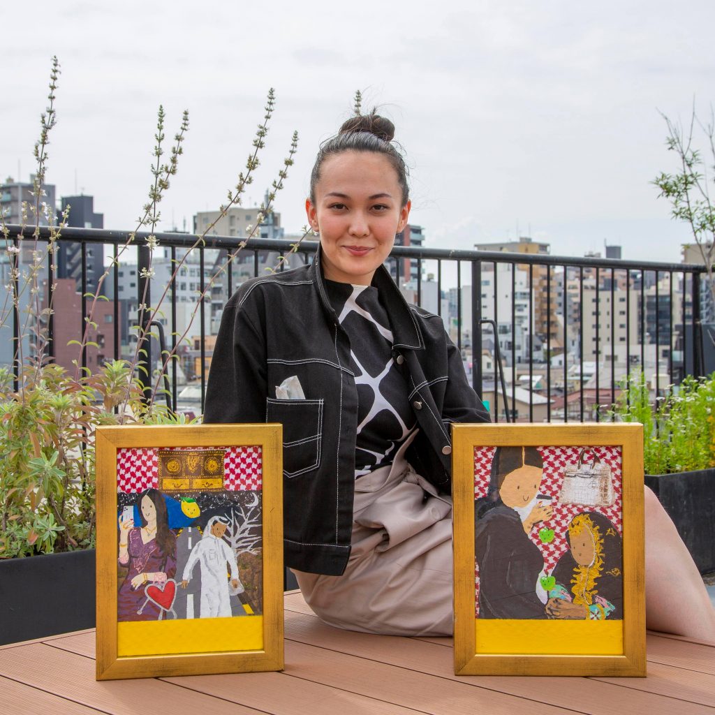 Founder, Editor-in-Chief and Curator Sophie Mayuko Arni with Salman Al Najem paintings. (Supplied)