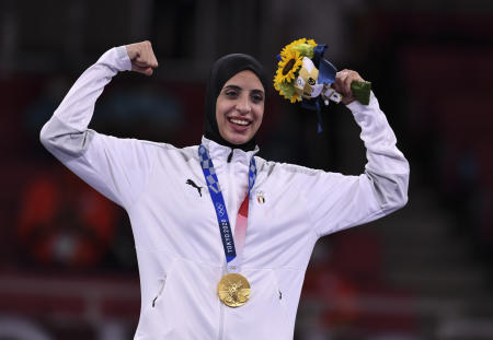 Egypt’s' Feryal Ashraf poses with her gold medal. (Reuters)