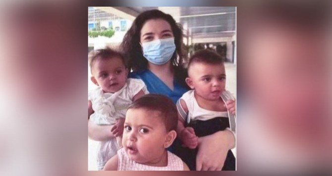 Lebanese nurse Pamela Zeinoun, who was hailed a national hero for rescuing 3 newborns at St George Hospital University Medical Center during August 4 Beirut explosion, reunited with them on Wednesday, the blast’s first anniversary. (Supplied)