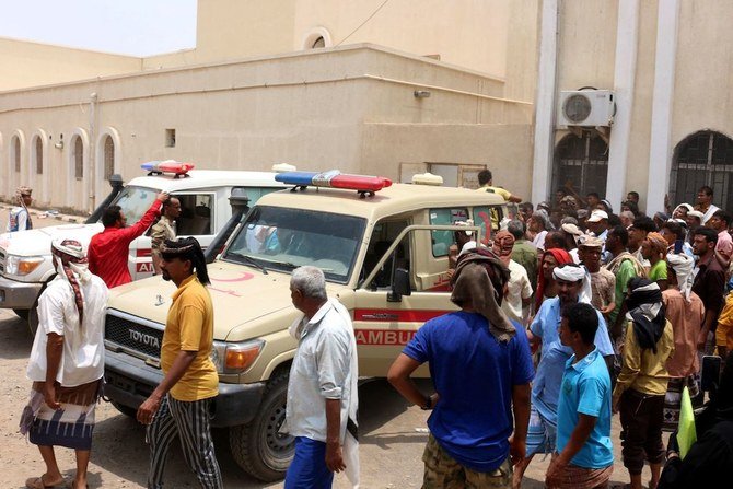 People gather as ambulances transport casualties of strikes on Al-Anad air base to the Ibn Khaldun hospital in the government-held southern province of Lahij, on August 29, 2021. (AFP)