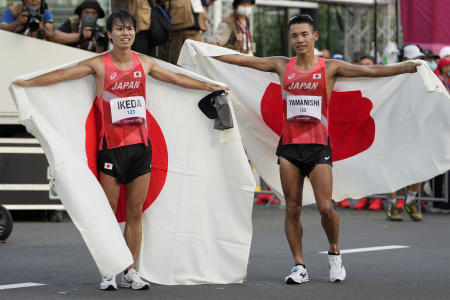 Koki Ikeda and Toshikazu Yamanishi, of Japan, pose after placing second and third respectively in the 20km race walk at the 2020 Summer Olympics, Thursday, Aug. 5, 2021, in Sapporo, Japan. (AP)