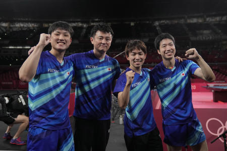 Japan's team celebrate after winning the table tennis men's team bronze medal match against South Korea at the 2020 Summer Olympics, Friday, Aug. 6, 2021, in Tokyo. (AP)