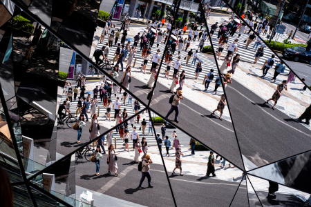 People wearing protective masks are reflected in the mirror at a shopping mall in Tokyo amid the coronavirus disease (COVID-19) outbreak in Tokyo, Japan, August 19, 2021. (Reuters)