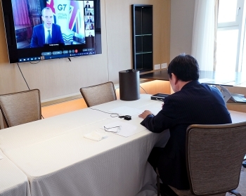 Japan's Motegi is seen attending from an unspecified location in Amman the online G7 Foreign Ministers' Meeting on the situation in Afghanistan. (Courtesy of MOFA).