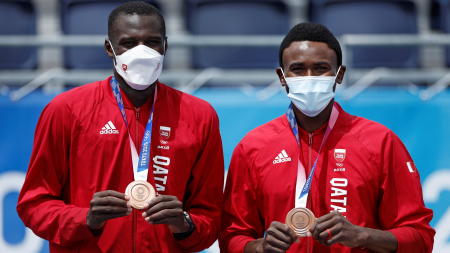 Bronze medallists Cherif Samba and Ahmed Tijan of Qatar pose with their medals. (Reuters)
