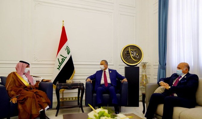 Iraqi Prime Minister Mustafa Al-Kadhimi and Iraqi FM Fuad Hussein meet with Saudi Arabia's Foreign Minister Prince Faisal bin Farhan ahead of the Baghdad summit in Baghdad, Iraq, August 28, 2021. (Reuters)