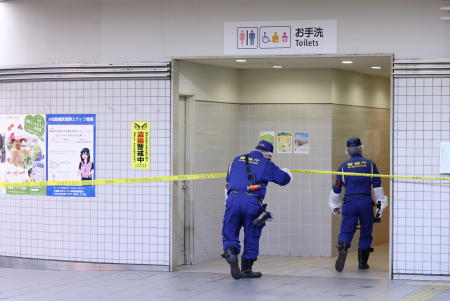 Police officers work at the site where a stabbing incident occurred on a train, at the Soshigaya-Okura station of the Odakyu Electric Railway in Setagaya Ward, Tokyo, Japan August 6, 2021. (Reuters)