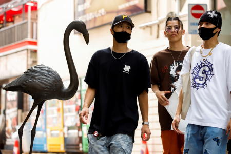 A group of men walk in the Harajuku shopping area, amid the coronavirus disease (COVID-19) outbreak in Tokyo, Japan August 9, 2021. (Reuters)