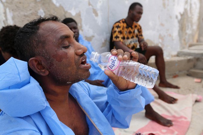 After being identified, migrants are sent to the temporary accommodation centers on the mainland or on the quarantine ferry ships moored in the waters in front of Lampedusa’s port. (AFP)