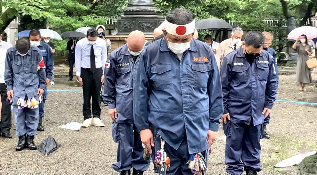 Some Japanese nationalists dressed in Imperial Army uniforms sported masks with Japan's Rising and Radiant Sun flag, an ancient symbol of the Imperial Army. (ANJP)