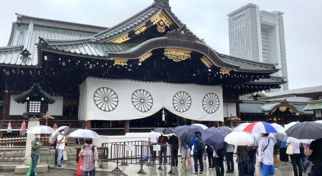 Some Japanese nationalists dressed in Imperial Army uniforms sported masks with Japan's Rising and Radiant Sun flag, an ancient symbol of the Imperial Army. (ANJP)