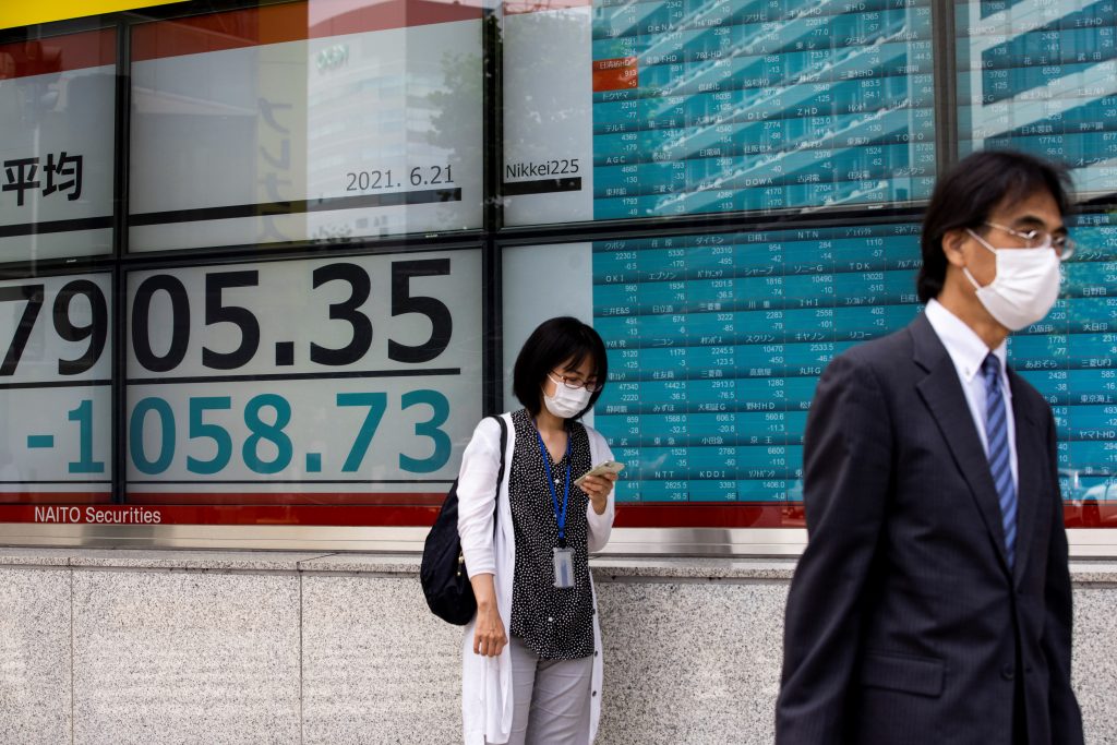 The Nikkei 225 index rose 1.29 percent, or 361.48 points, to 28,451.02. (AFP)