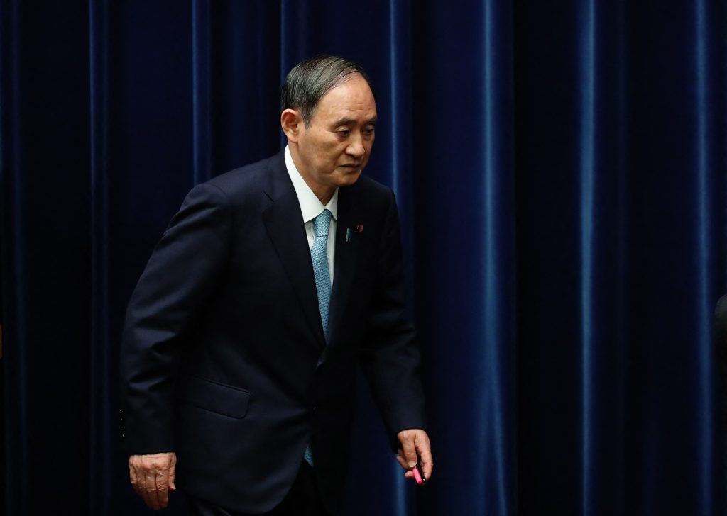 Japan's Prime Minister Yoshihide Suga leaves after a press conference on Covid-19 coronavirus countermeasures, at his office in Tokyo on September 9, 2021. (AFP)