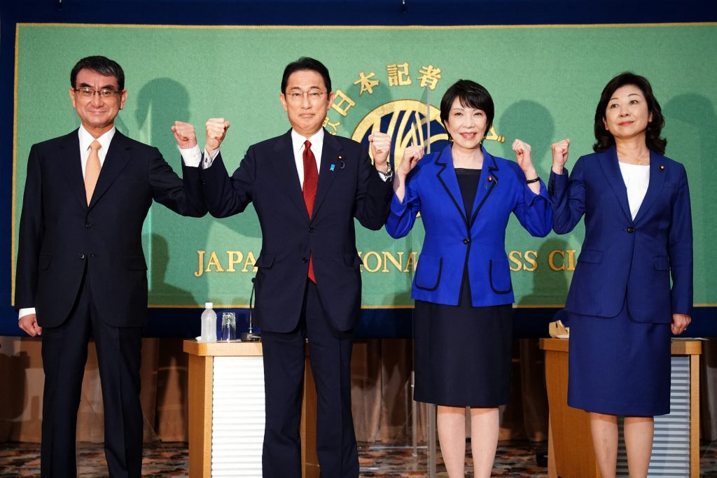 Candidates for the presidential election of the ruling Liberal Democratic Party, (from L-R) Taro Kono, the cabinet minister in charge of vaccinations, Fumio Kishida, former foreign minister, Sanae Takaichi, former internal affairs minister, and Seiko Noda, former internal affairs minister, pose for photographers prior to a debate session at the Japan National Press club in Tokyo on September 18, 2021. (AFP)