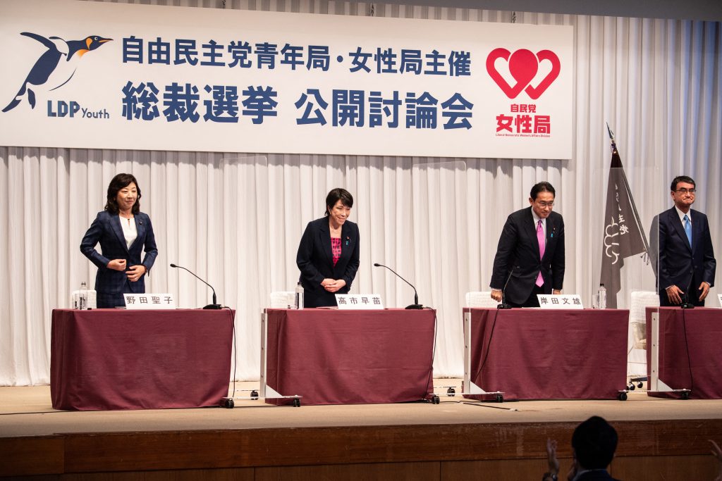 The four candidates share the view that the country should resume the Go To stimulus programs once the pandemic is brought under control. (AFP)