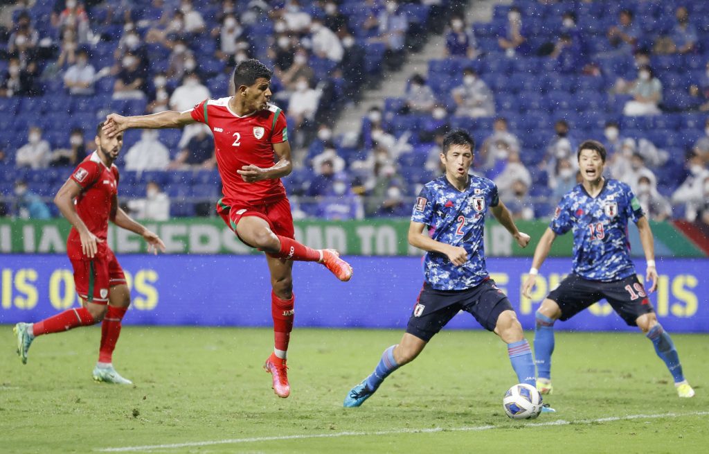 Oman's Issam Al Sabhi kicks the ball to score against Japan. (File photo/Kyodo via Reuters)