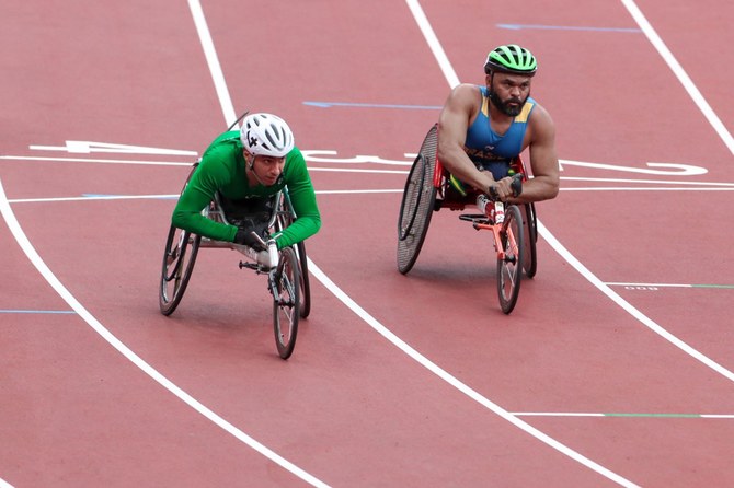 Fahad Al-Junaidel (left) on his way to qualifying to the Men's 100m T-53 final at Tokyo Olympic Stadium. (Supplied)