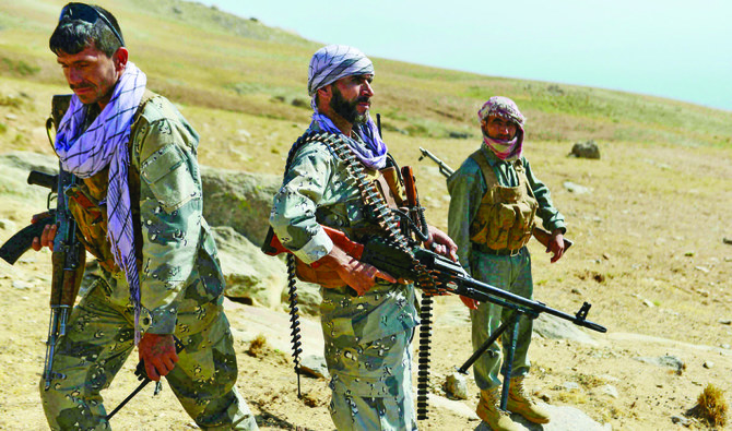 Afghan resistance front and anti-Taliban uprising forces patrol on a hilltop in Anaba district, Panjshir province. (AFP)