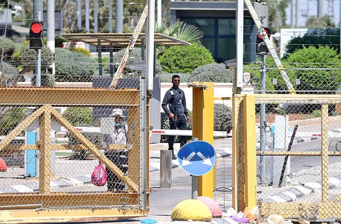 An Israeli soldier stands watch at a checkpoint in West Bank town of Jenin after it was closed following the break out of six Palestinian prisoners. (AFP)