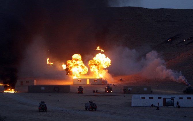 A fire ball and vehicles are seen as Saudi special force units attached to the Ministry of Interior train in al-Haytheiyah, 100 kms north of Riyadh, on June 9, 2010. (File/AFP)