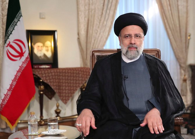 President Ebrahim Raisi attends a live televised interview with state-run TV on Sept. 4. (AP)