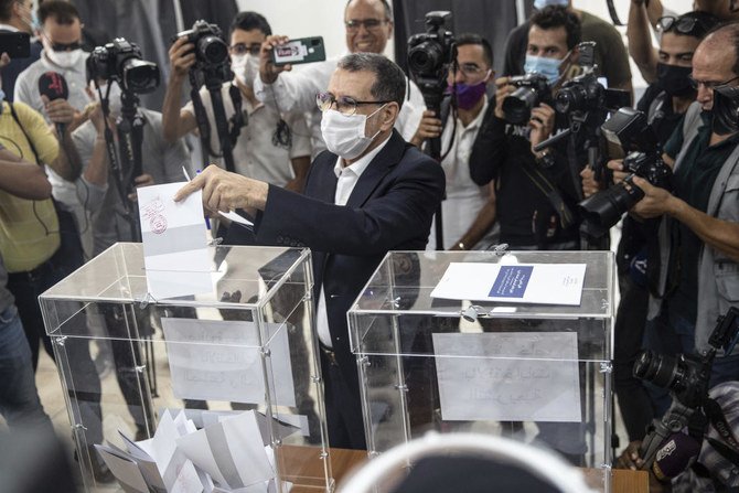 Morocco Prime Minister and head of the PJD Islamist party Saad Eddine el-Othmani casts his ballot in Rabat on Wednesday. Moroccans are voting in legislative, regional and local elections amid strict virus safety guidelines. (AP)