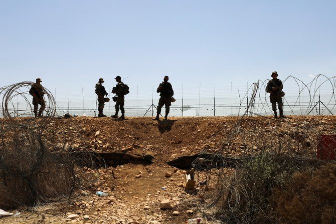 Israeli soldiers guard along a fence leading to the West Bank as part of search efforts to capture Palestinian men who had escaped from Gilboa prison. (File/Reuters)