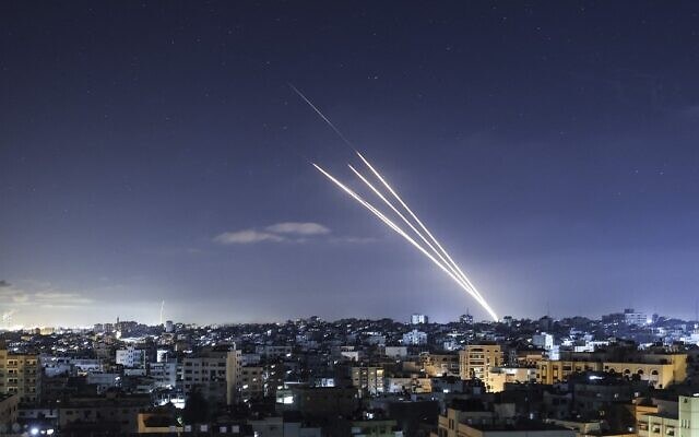 Illustrative: Rockets are launched towards Israel from Gaza City in May. (AFP/File Photo)