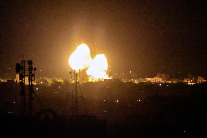 A fireball rises following an air strike in Rafah in the southern Gaza Strip early Monday. Israel launched airstrikes against Gaza, a source inside the enclave said. (Photo by Said Khatib / AFP)