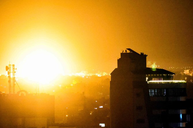 A fireball rises following an air strike in Rafah in the southern Gaza Strip early Monday. Israel launched airstrikes against Gaza, a source inside the enclave said. (Photo by Said Khatib / AFP)