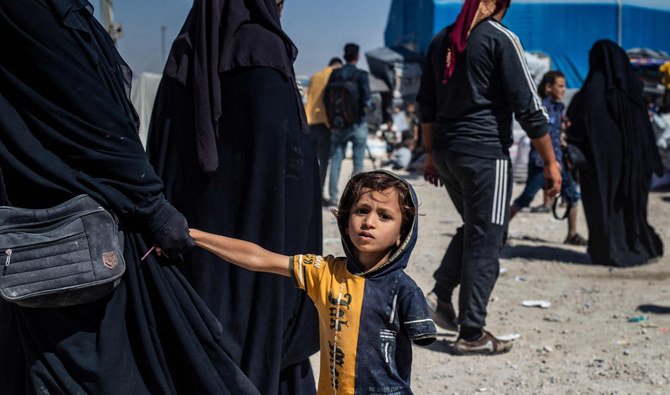 People prepare to return home with loved ones released from the Kurdish-run Al-Hol Camp, which holds kin of Daesh fighters, in Syria’s Hasakeh governorate. (AFP)