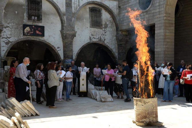 Iraqi christians chant during the inauguration ceremony for the new bell at Syriac Christian church of Mar Tuma in Mosul. (AFP)