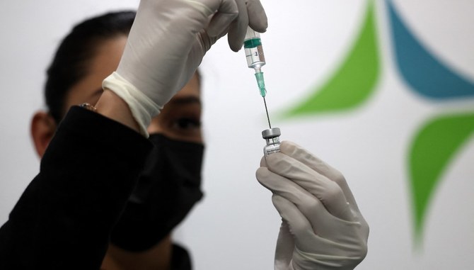 The UAE has administered total 19,412,656 COVID-19 doses so far, for a vaccine distribution rate equivalent to 196.28 doses per 100 people. (AFP)