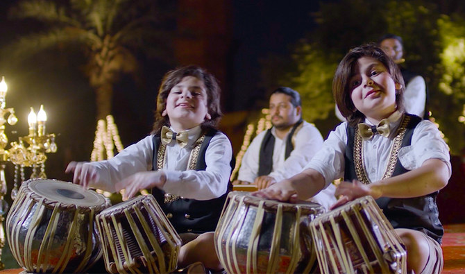 Pakistani brothers Riyan and Isaac Czar performing the Saudi national anthem on local instruments in Lahore September 2021. (Photo courtesy: Dr. Shehrezad Zaar)