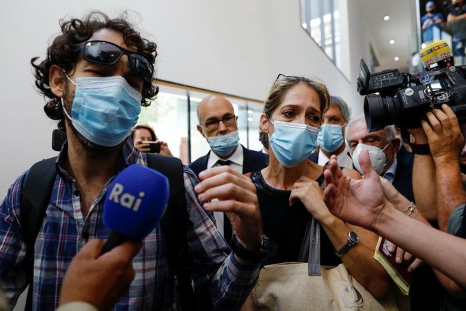 Aya Biran, the paternal aunt of Eitan Biran, speaks to members of the media before the start of a court hearing over the alleged kidnapping of Biran at a court in Tel Aviv on Sept. 23, 2021. (Reuters)