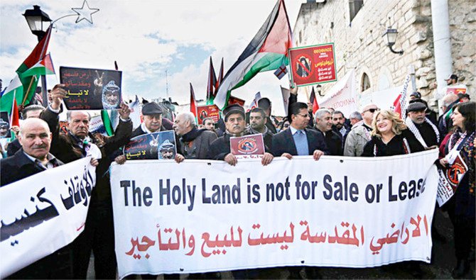 Palestinians in Bethlehem protest against the selling of land to Israelis. (AP/File)