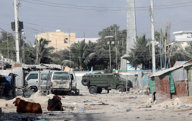 An armoured personnel carrier (APC) drives on a sealed off street to prevent a protest over delayed elections in Mogadishu, Somalia, on February 19, 2021. (Reuters)