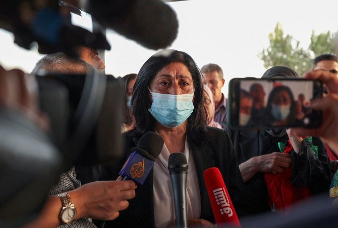 Palestinian lawmaker Khalida Jarrar talks to reporters in Ramallah city in the occupied West Bank, following her release from an Israeli prison on Sept. 26, 2021. (AFP)