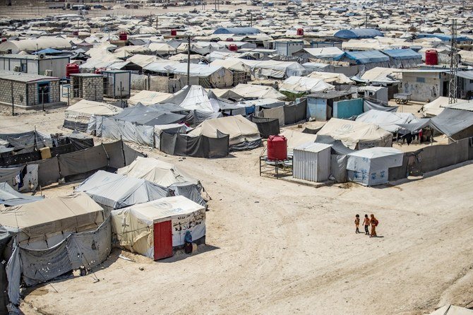 Children walk among shelters at the Kurdish-run Al-Hol camp, in Syria's northeastern Hasakeh governorate. (File/AFP)