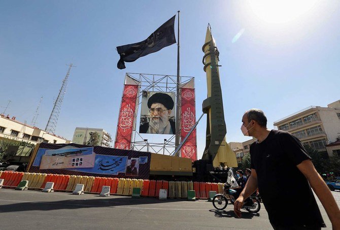 A mock Shahab-3 surface-to-surface missile is displayed at a street exhibition by Iran's army and paramilitary Revolutionary Guard. (File/AFP)