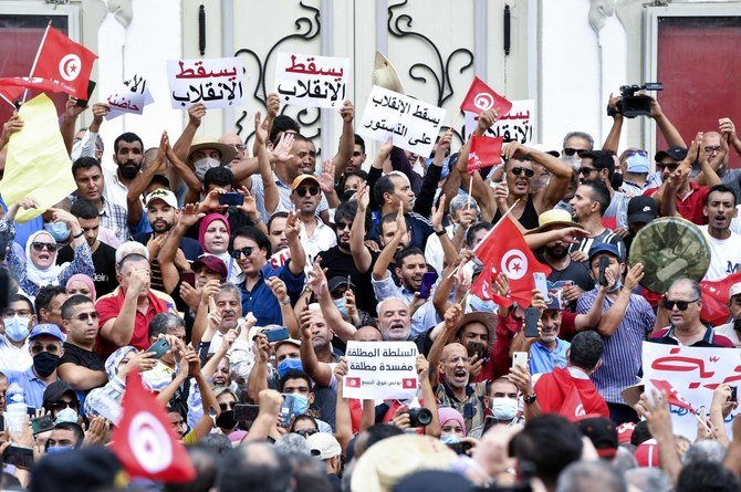 Tunisian demonstrators shout slogans against President Kais Saied during a protest in the capital Tunis on September 18, 2021. (AFP)