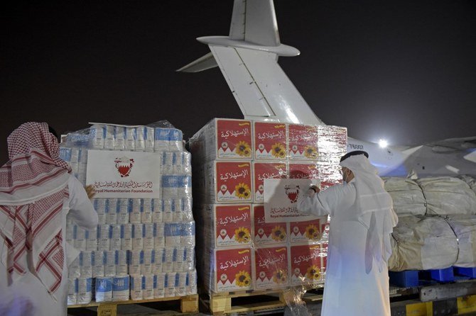 Volunteers label a shipment of humanitarian aid to be sent to Afghanistan at Bahrain International Airport on Muharraq Island, near the capital Manama, on September 4, 2021. (AFP)