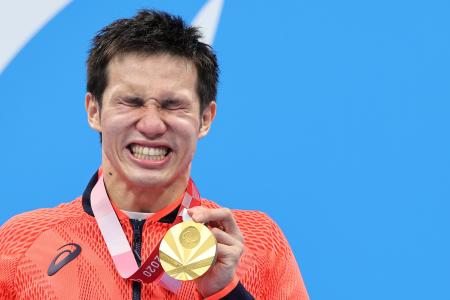 Gold medalist Keiichi Kimura of Japan reacts on the podium. (Reuters)