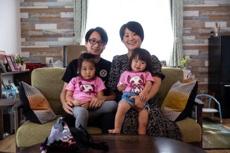 In this photo taken on August 28, 2021, Japanese violinist Manami Ito (top R), poses with her husband Yuki and their two daughters Miu (L) and Mei at their residence in Shizuoka. (AFP)